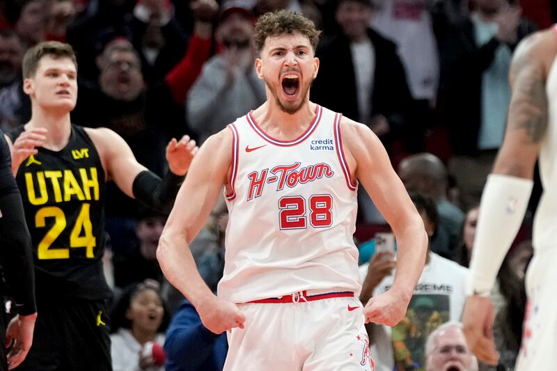 Houston Rockets center Alperen Sengun (28) reacts after making a basket and drawing a foul during overtime of an NBA basketball game against the Utah Jazz, Saturday, Jan. 20, 2024, in Houston. (AP Photo/Eric Christian Smith)