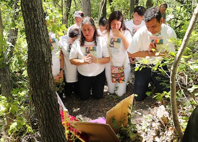 Libertad Edith Salgado Figueroa, mother of Elizabeth Elena Laguna Salgado, and family members pray on Friday, June 15, 2018 where her body was found in Hobble Creek Canyon.