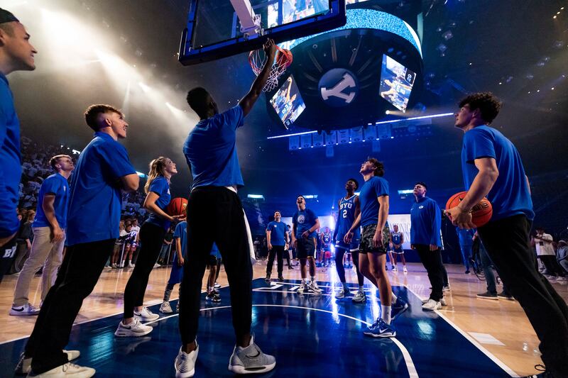 BYU players warm up prior to annual Midnight Madness event this fall at the Marriott Center in Provo, Utah.