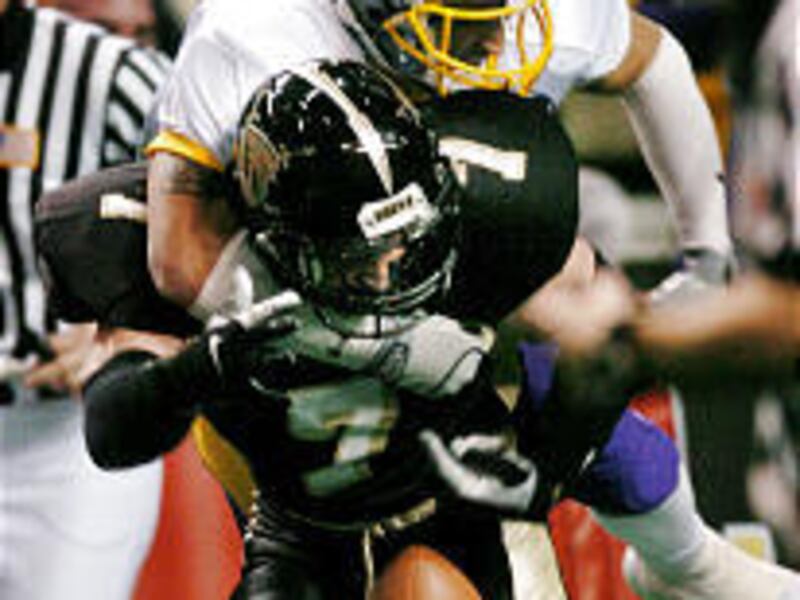 Colorado's Chalie Ricks knocks the ball away from Utah defensive back Trevor Bell after a Bell pick.