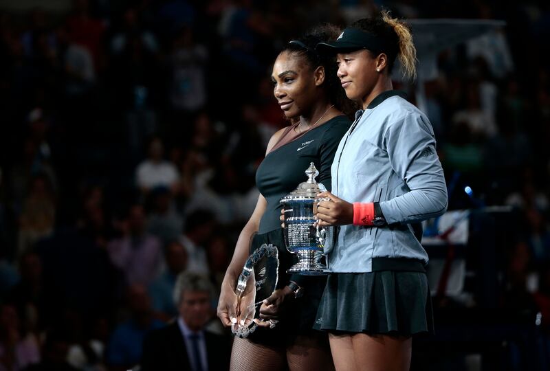 Serena Williams, left, and Naomi Osaka, of Japan, pose for photos during the trophy ceremony after Osaka defeated Williams in the women's final of the U.S. Open tennis tournament, Saturday, Sept. 8, 2018, in New York.