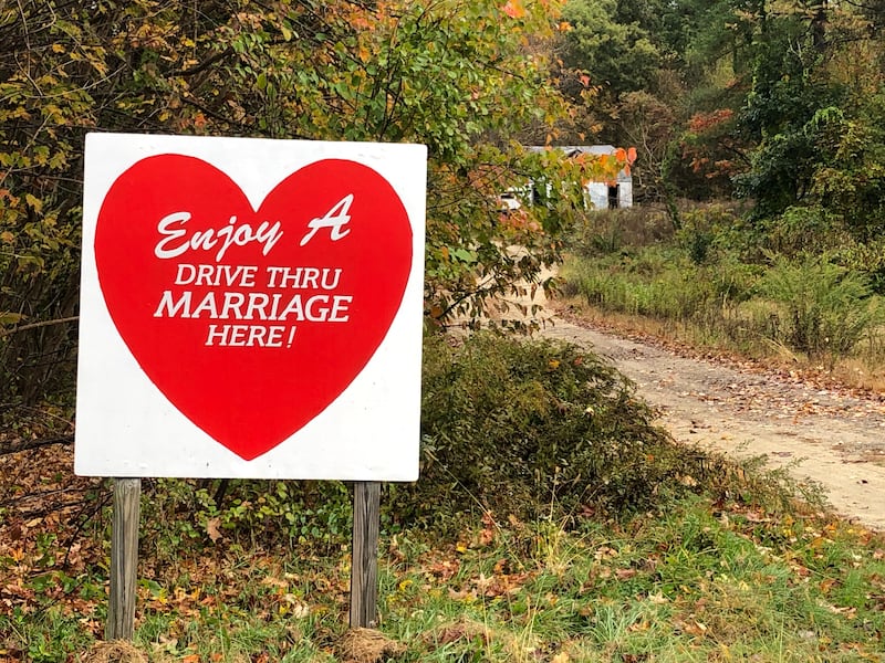 A sign in western Massachusetts advertises drive-through weddings at a private home.