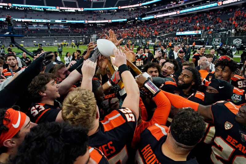 Oregon State players celebrate after defeating Florida in the 2022 Las Vegas Bowl.