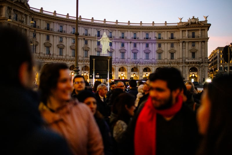 The Church of Jesus Christ of Latter-day Saints' logo is projected onto a building at Piazza della Repubblica in Rome, Italy, in preparation for a Light the World video presentation that was displayed to celebrate Rome's new Giving Machines on Monday, Dec. 8, 2025.