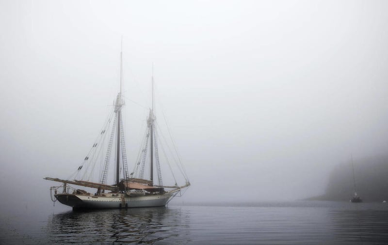 In this photo made Friday, Aug. 3, 2012, the schooner Mary Day sits at anchor in the morning fog off South Brooksville, Maine. The 90-foot Mary Day, which is celebrating its 50th season, is the first schooner in the Maine windjammer fleet to be built spec