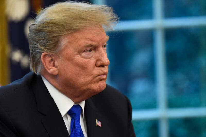 FILE - President Donald Trump listens during his meeting with Chinese Vice Premier Liu He in the Oval Office of the White House in Washington, Friday, Feb. 22, 2019.