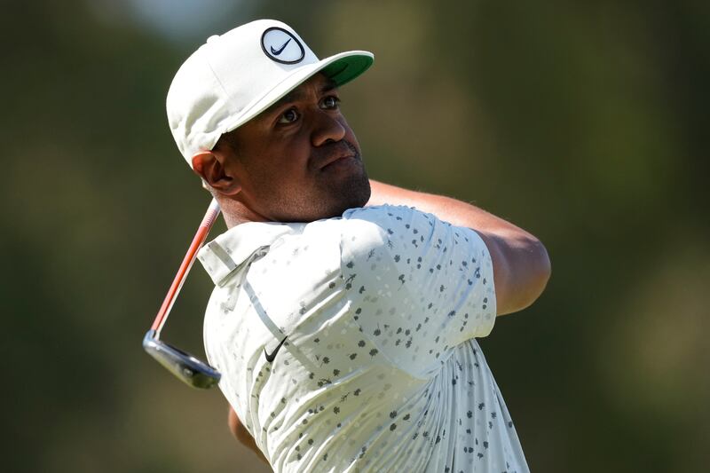 Tony Finau watches his tee shot on the seventh hole during the third round of the U.S. Open golf tournament at Los Angeles Country Club on Saturday, June 17, 2023, in Los Angeles. (AP Photo/Marcio J. Sanchez)