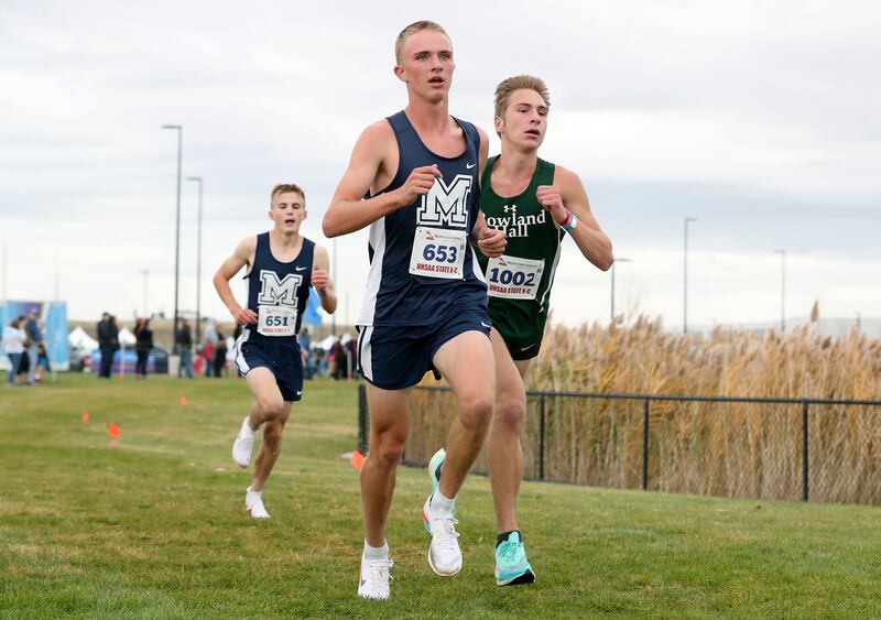 Millard’s Camden Moat (651), Millard’s Michael Ralphs (653) and Rowland Hall’s Ezra Shilling Rabin (1002) compete in the 2A boys cross-country state championships.