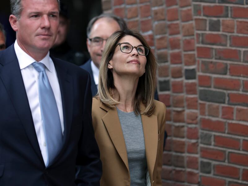 Actress Lori Loughlin departs federal court in Boston on Wednesday, April 3, 2019, after facing charges in a nationwide college admissions bribery scandal.