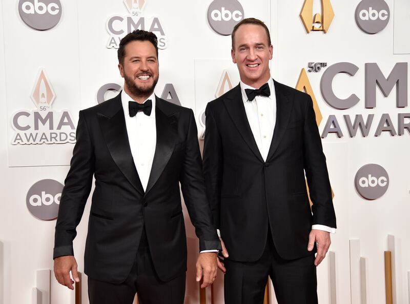 Luke Bryan and Peyton Manning arrive at the 56th Annual CMA Awards at the Bridgestone Arena in Nashville, Tenn.