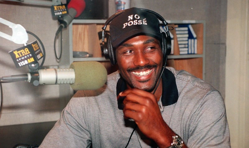 Karl Malone of the Utah Jazz smiles while hosting a two-hour afternoon talk show at a radio station in Burbank, Calif., Monday, Oct. 26, 1998. Malone is taking advantage of the extra time he has due to the NBA lockout by pursuing his other talents. (AP Ph