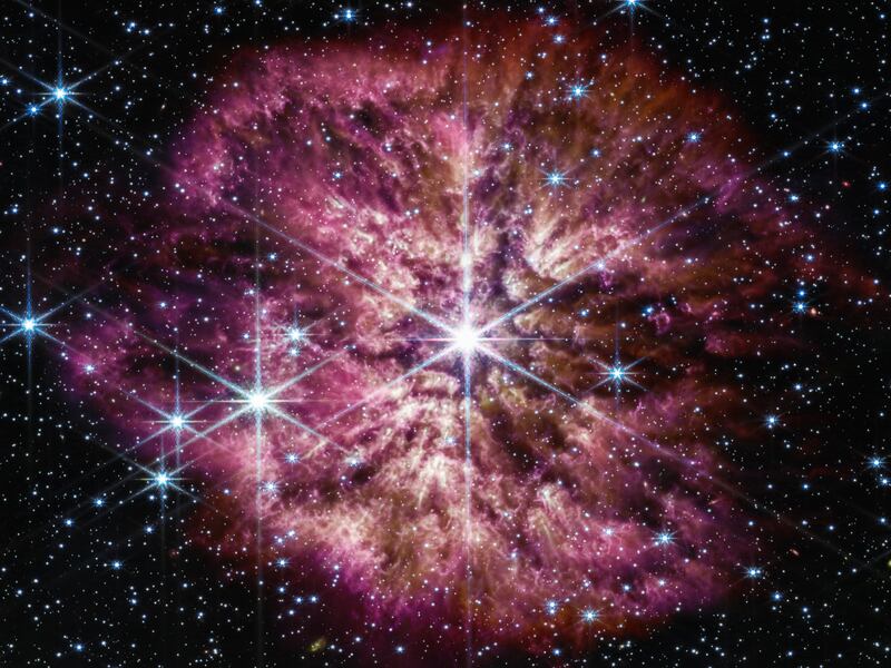 This image provided by NASA shows the star Wolf-Rayet 124, center, captured by the James Webb Space Telescope in June 2022. A surrounding nebula is made of material cast off from the aging star in random ejections, and from dust produced in the ensuing turbulence. The telescope captured the rare and fleeting phase of the star on the cusp of death.