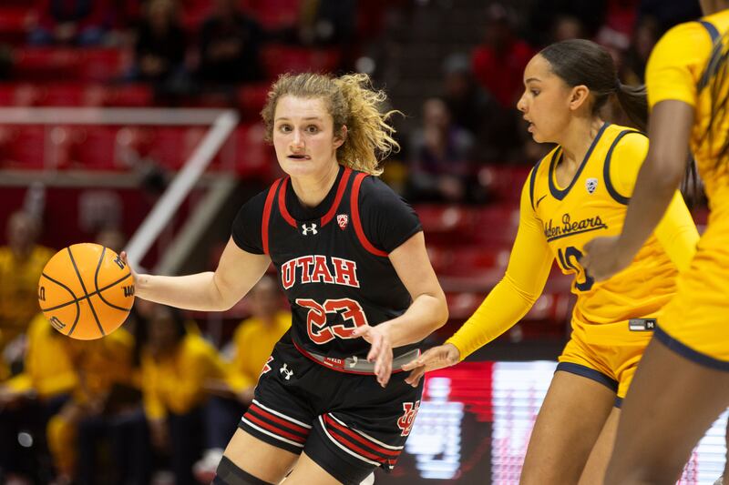 Utah Utes guard Matyson Wilke (23) drives the ball against University of California’s guard Lulu Twidale (10) at University of Utah’s Huntsman Center in Salt Lake City on Jan. 14, 2024. University of Utah won 93-56.