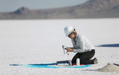 University of Utah Department of Geology and Geophysics scientist Lily Wetterlin examines layers during a project to measure the thickness of the salt crust on the Bonneville Salt Flats using sonic coring on Tuesday, Sept. 6, 2016. The area is the remnant