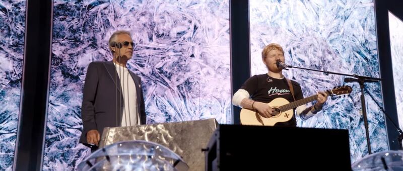 Andrea Bocelli (left) and Ed Sheeran sing "Perfect Symphony" at Wembley Stadium in London.