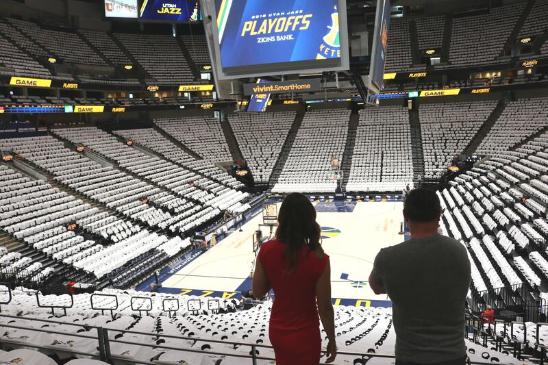 Meikle LaHue, left, and Jeremy Castro look out at the seats at Vivint Arena on Monday, April 23, 2018. The two oversee music for the Utah Jazz's home games.