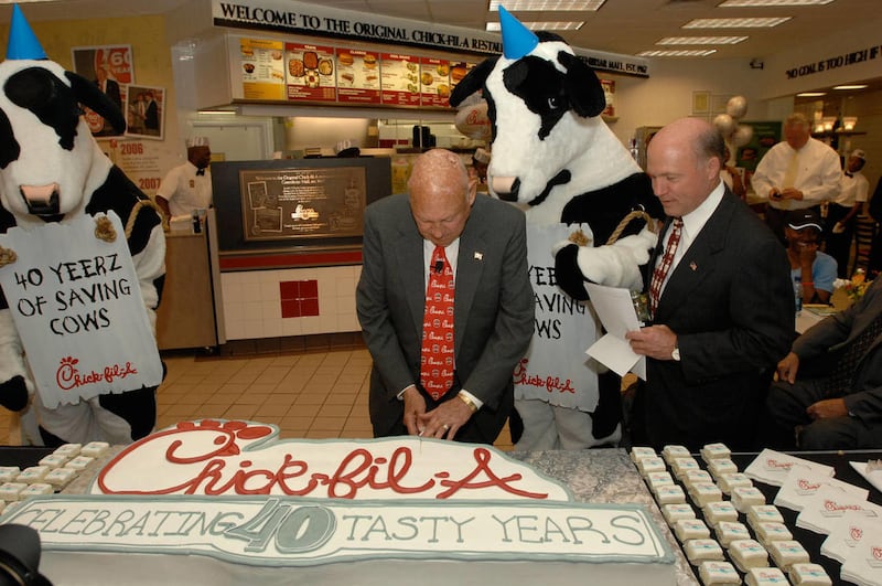 Atlanta-based restaurant chain Chick-fil-A celebrated its 40th anniversary on June 28, 2007 at the site of the chain's first restaurant. Founder Truett Cathy (shown cutting the cake), his son President and COO Dan Cathy (watching alongside on Truett's lef