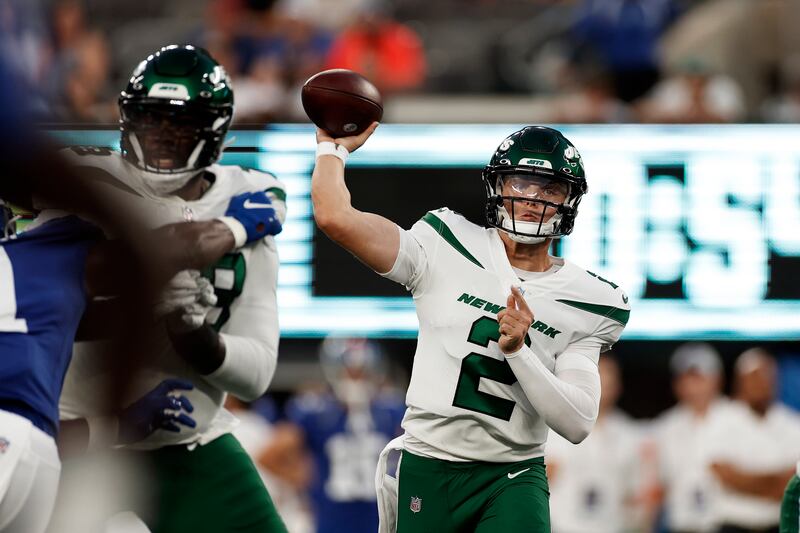 New York Jets quarterback Zach Wilson passes against the New York Giants during a preseason NFL game.