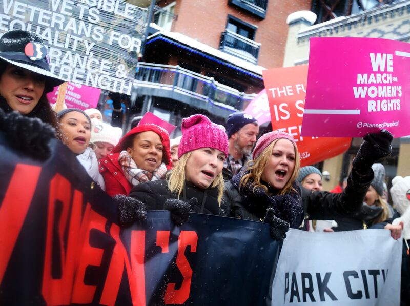 American environmental activist Laurie David, left, comedian and television host Chelsea Handler, and actress Mary McCormack attend the Women’s March on Main in Park City on Saturday, Jan. 21, 2017.