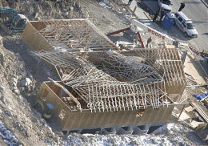 The roof of this partially constructed home in Eagle Mountain came tumbling down Tuesday, injuring two workers.