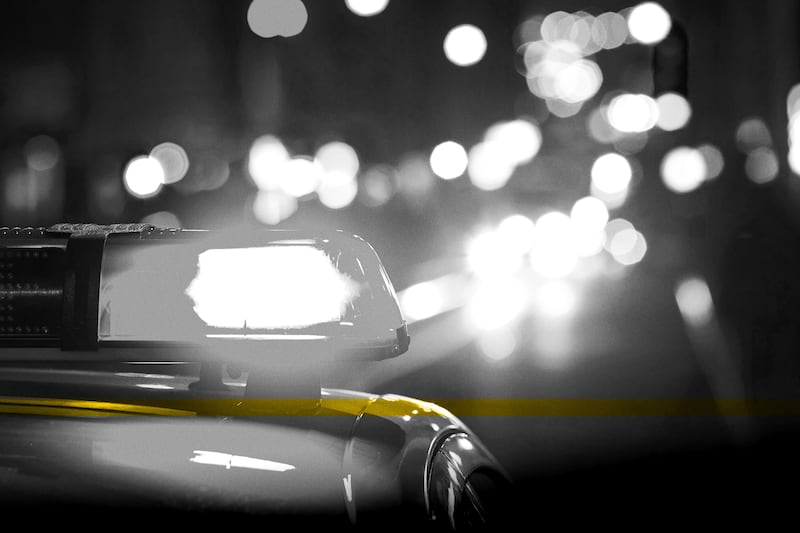 Police car with flashing lights. An Alabama woman disappeared Thursday night after calling the police to report seeing a toddler walking alone on the highway. 