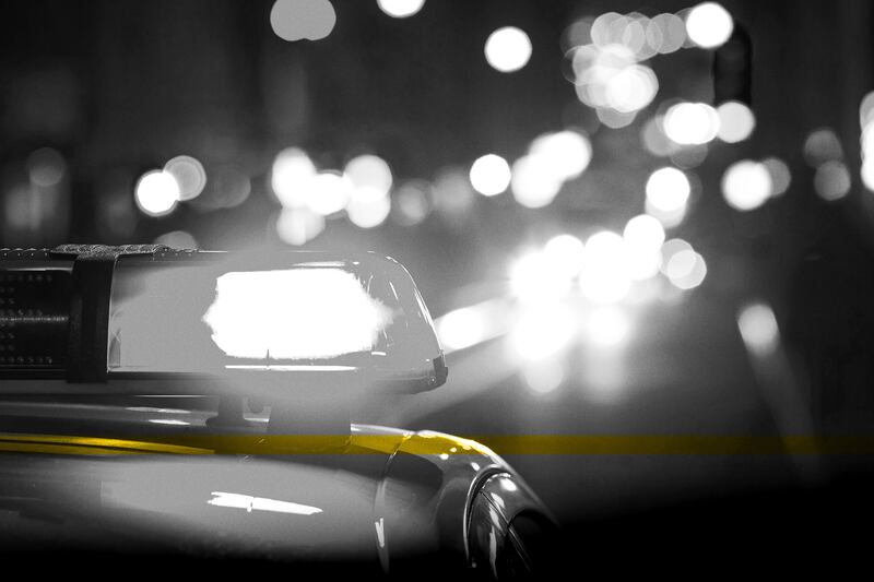 Police car with flashing lights. An Alabama woman disappeared Thursday night after calling the police to report seeing a toddler walking alone on the highway. 