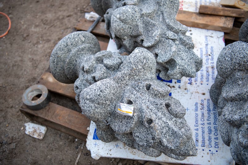 Some pieces of original, pioneer-era stonework are removed and carefully catalogued and stored.