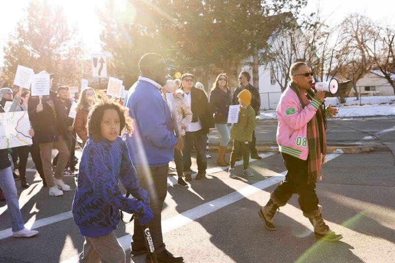 Emma E. Houston, assistant vice principal for equity, diversity and inclusion and chief diversity officer at University of Utah, leads community members during a march in honor of Martin Luther King Jr. in Salt Lake City on Jan. 15, 2024.