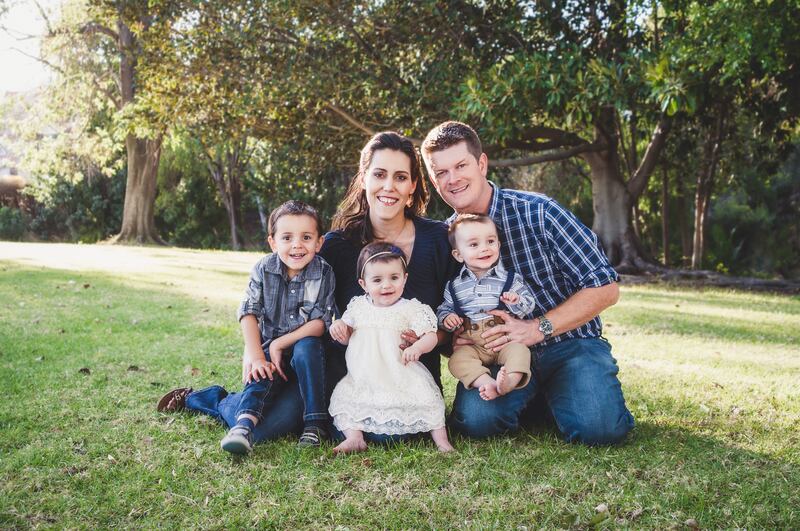 Camila and John Williams, with their children Robert, 3, and year-old twins Juliana and Joshua, in February.