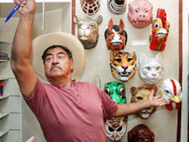 Vic Rael helps with the auction at Salt Lake Costume Co. on Tuesday. Inventory included about 40,000 pieces.