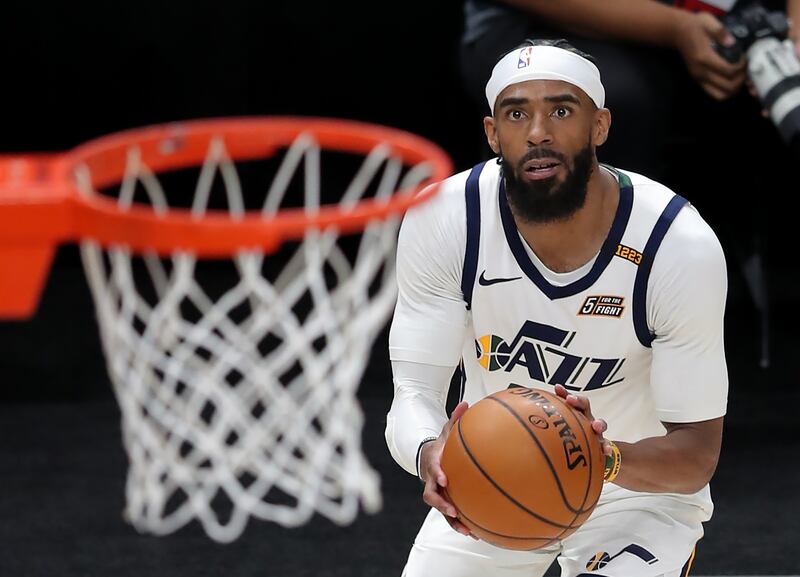 Utah Jazz guard Mike Conley eyes the basket as he goes up for and hits a 3-point shot.