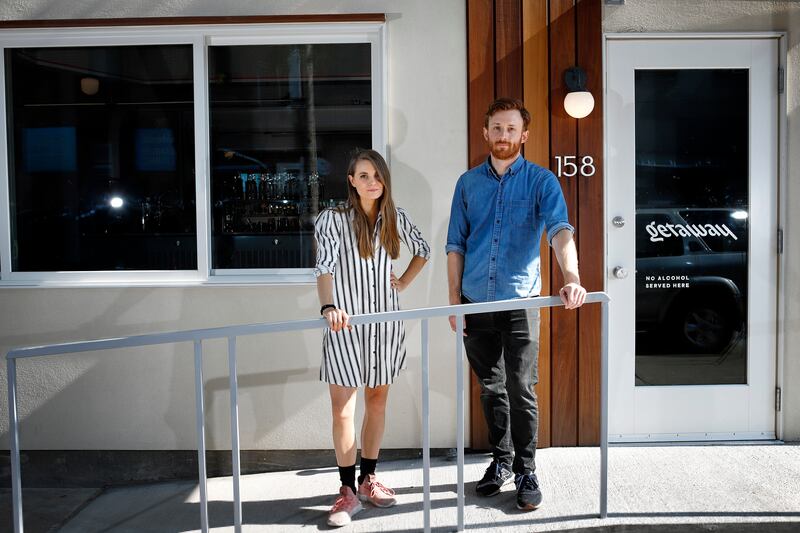 Sam Thonis, 31, and Regina Dellea, 29, pictured Saturday, July 27, 2019, opened Getaway, an alcohol-free bar in Brooklyn, New York, on April 9, 2019. The bar serves mixed drinks for $13  as well as some snack food items.