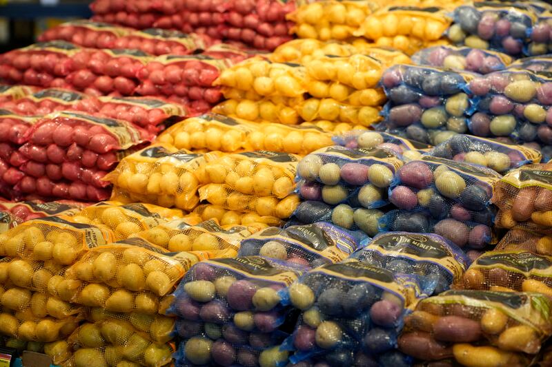 Bags of potatoes are shown on display in the produce section of the Table Mesa King Soopers store.