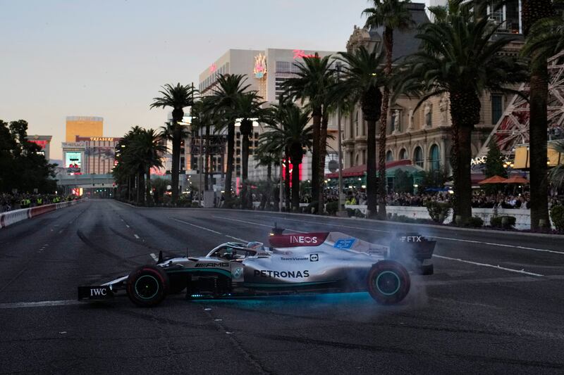 George Russell does a burnout along the Las Vegas Strip at a launch party for the Formula One Las Vegas Grand Prix.