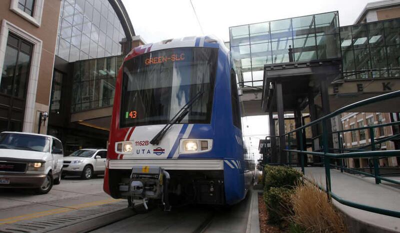 A Trax train moves up Main Street in front of the new City Creek Center in Salt Lake City on Monday, March 19, 2012. The Utah Transit Authority is considering ending the \"free fare zone\" for buses while maintaining the popular transit feature for light
