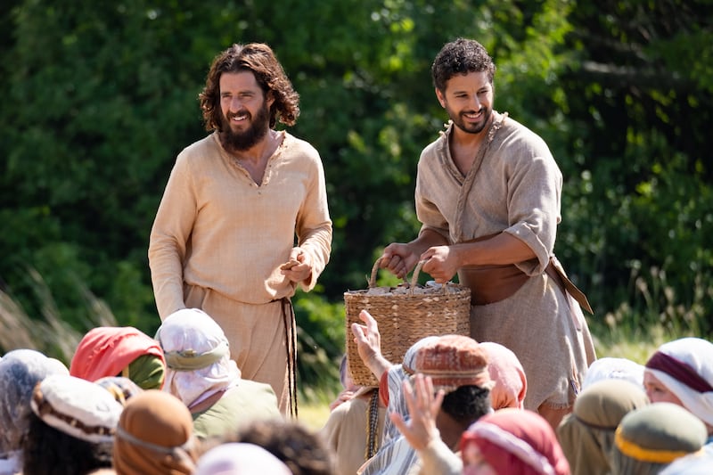 Actors Jonathan Roumie, who plays Jesus, and Alaa Safi, who plays Simon the Zealot, film the feeding of the 5,000 scene for “The Chosen.”