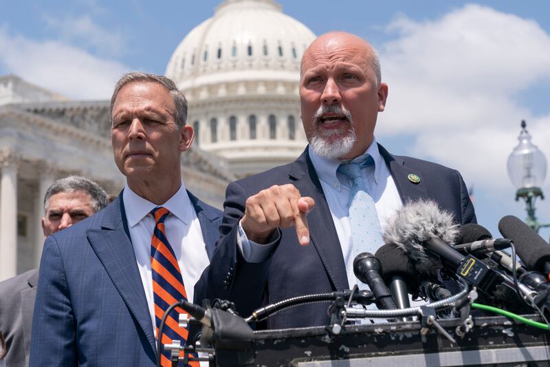 Rep. Scott Perry, R-Pa., left, and Rep. Chip Roy, R-Texas speak with reporters on Capitol Hill in Washington.