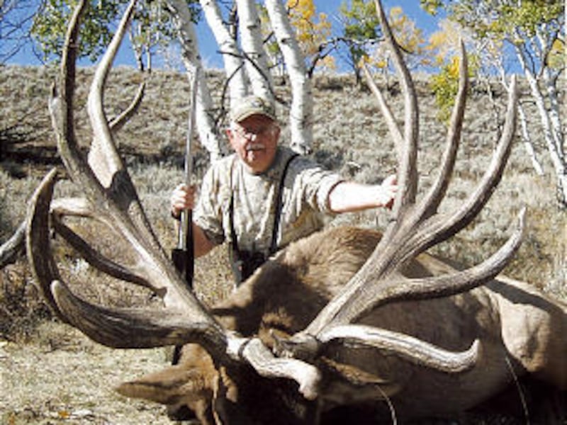 Denny Austad of Ammon, Idaho, shows off the prize elk he killed in south-central Utah. The bull elk set a Boone and Crockett Club record for antlers: 4785/8 points.