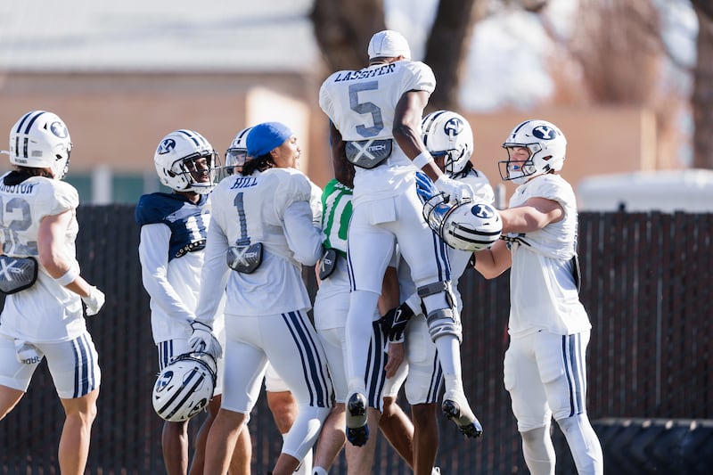 Receiver Darius Lassiter (No. 5) celebrates a big play during practice in Provo this spring.