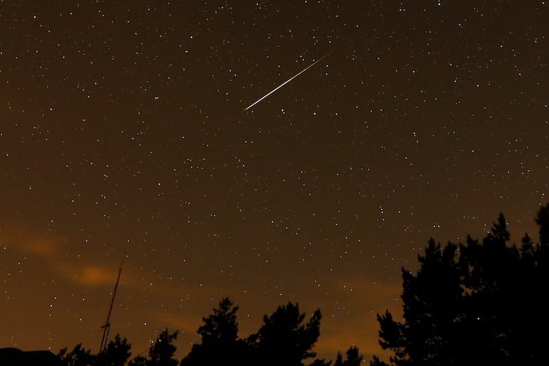 In this long exposure photo, a streak appears in the sky during the annual Perseid meteor shower at the Guadarrama mountains, on Aug. 12, 2016. The Taurid meteor shower peaks this week.