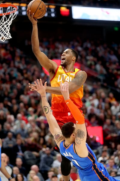 Utah Jazz forward Derrick Favors (15) fouls Oklahoma City Thunder forward Abdel Nader (11) as he shoots during an NBA game at the Vivint Smart Home Arena in Salt Lake City on Monday, March 11, 2019. The Jazz lost 98-89.