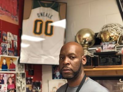 Jazz wing Royce O’Neale’s Harker Heights High School coach Celneque Bobbit poses in front of his former player’s Baylor University jersey in his office on Thursday, Oct. 26 in Harker Heights, Texas. “I just ask my guys for a jersey, really that’s all I wa
