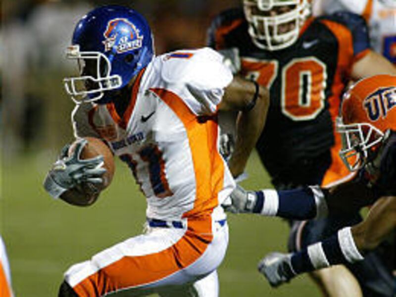Boise State's Drisan James, left, rushes past Texas-El Paso's Chris Mineo (70).