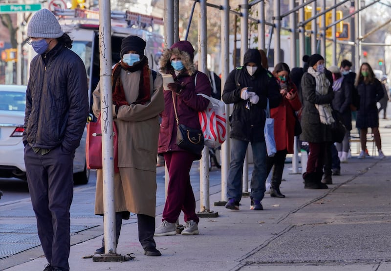 In this Nov. 18, 2020, file photo, people wait in a line stretching around a block, outside a CityMD urgent care clinic offering COVID-19 testing in the Park Slope neighborhood of the Brooklyn borough of New York.