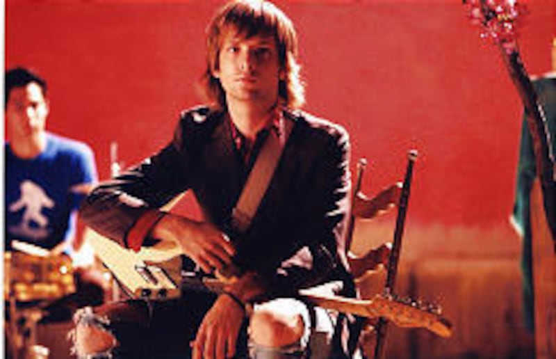 James Valentine is guitarist for Maroon 5, which won Best New Artist at the Grammy Awards.<BR> His parents live in Highland.