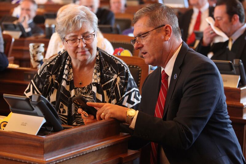 Kansas House health committee chair Brenda Landwehr, left, confers with Majority Leader Chris Croft during a vote on overriding Democratic Gov. Laura Kelly’s veto of a transgender bathroom bill.