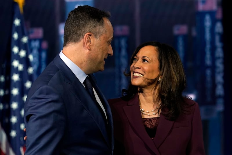 Democratic vice presidential candidate Sen. Kamala Harris, D-Calif., is joined on stage by her husband Doug Emhoff after she spoke during the third day of the Democratic National Convention, Wednesday, Aug. 19, 2020, at the Chase Center in Wilmington, Del.