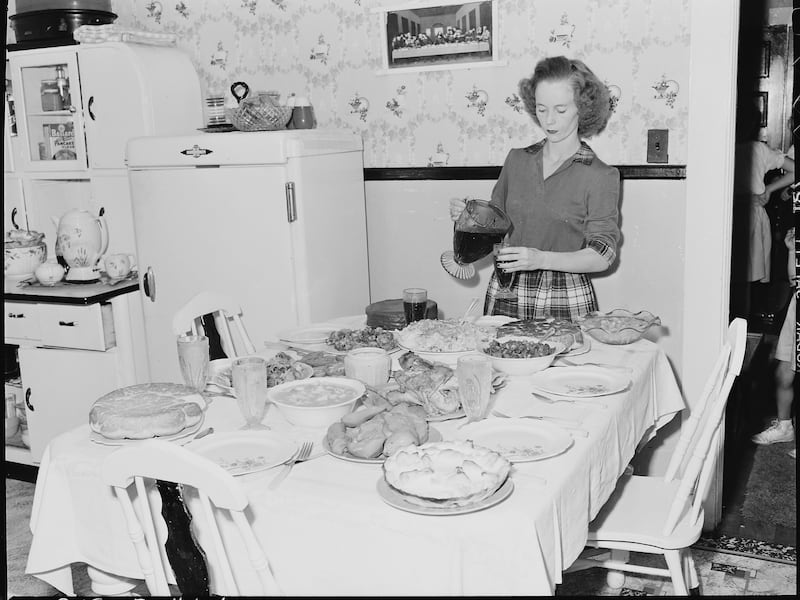 Geraldine Fain, daughter of Harry Fain, coal loader, completes setting of table for Sunday dinner.