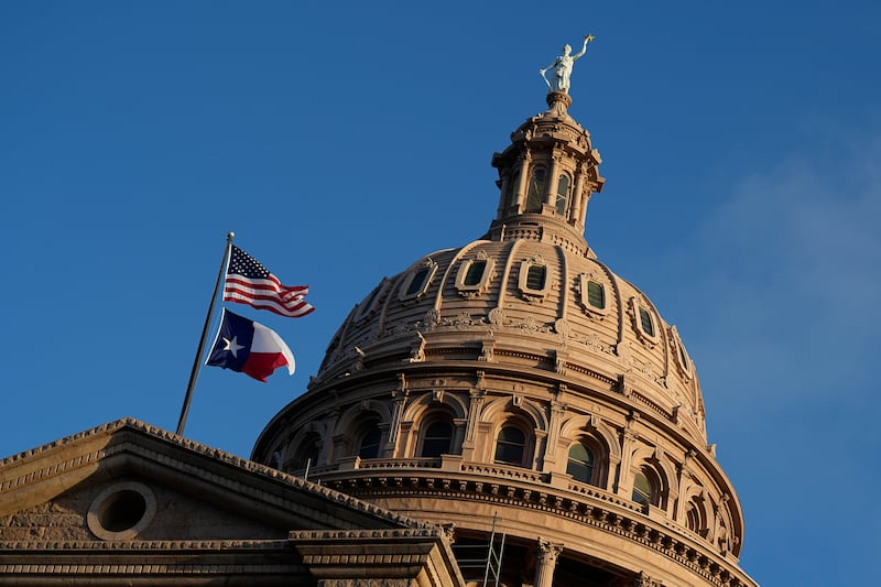 The U.S. and Texas flags fly over the Texas Capitol during the first day of the 88th Texas Legislative Session in Austin, Texas, Tuesday, Jan. 10, 2023.