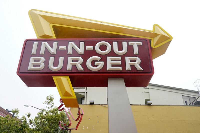The sign to an In-N-Out restaurant is shown at San Francisco’s Fisherman’s Wharf, Wednesday, Oct. 20, 2021.
